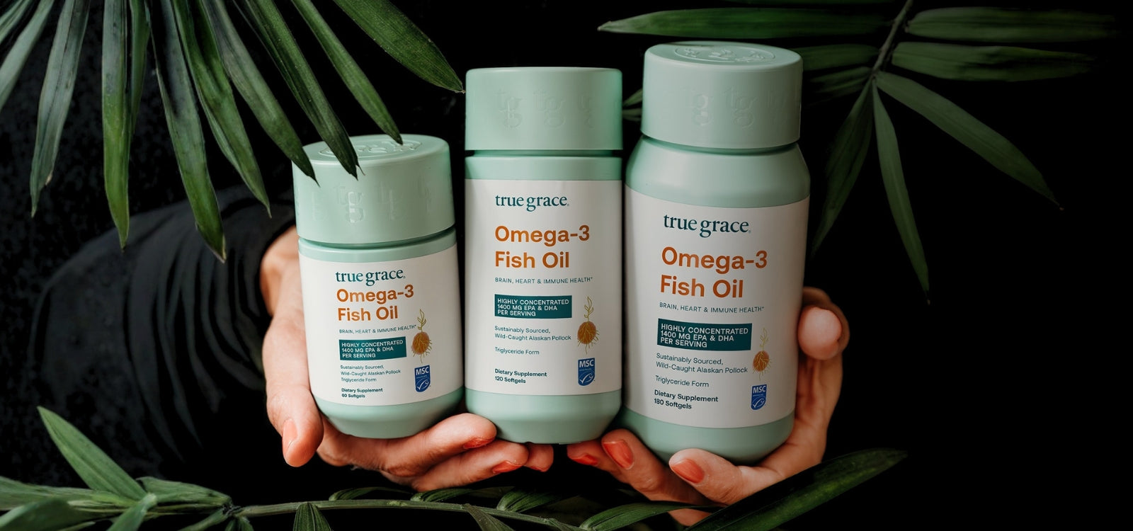 Omega-3 Fish Oil by True Grace held in palm leaves with new MSC Certified label.