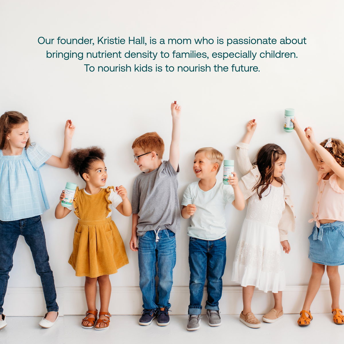 Children playing while holding Daily Kids multivitamin bottles in a lifestyle scene