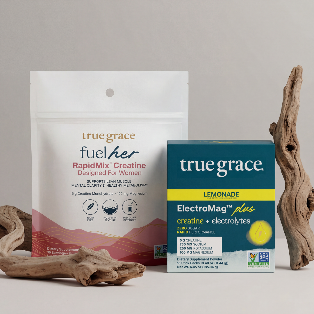 true grace fuel her RapidMix Creatine package and ElectroMag Plus Lemonade box on a neutral background with driftwood.
