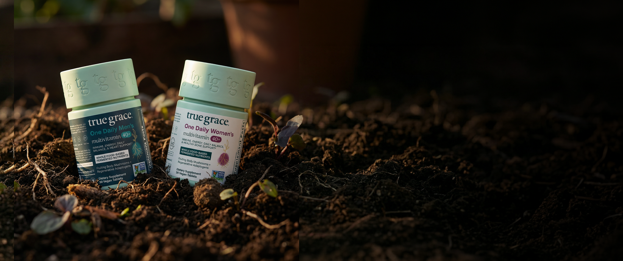 Two 'true grace' multivitamin products on a dark, textured surface